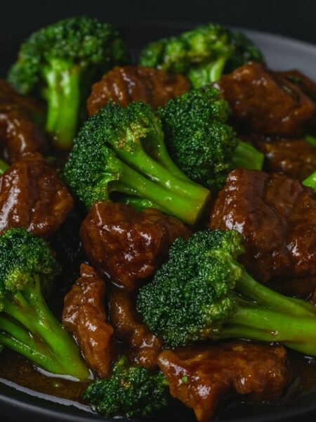 Slices of beef stir-fried with crisp broccoli florets coated in a savory garlic soy sauce.